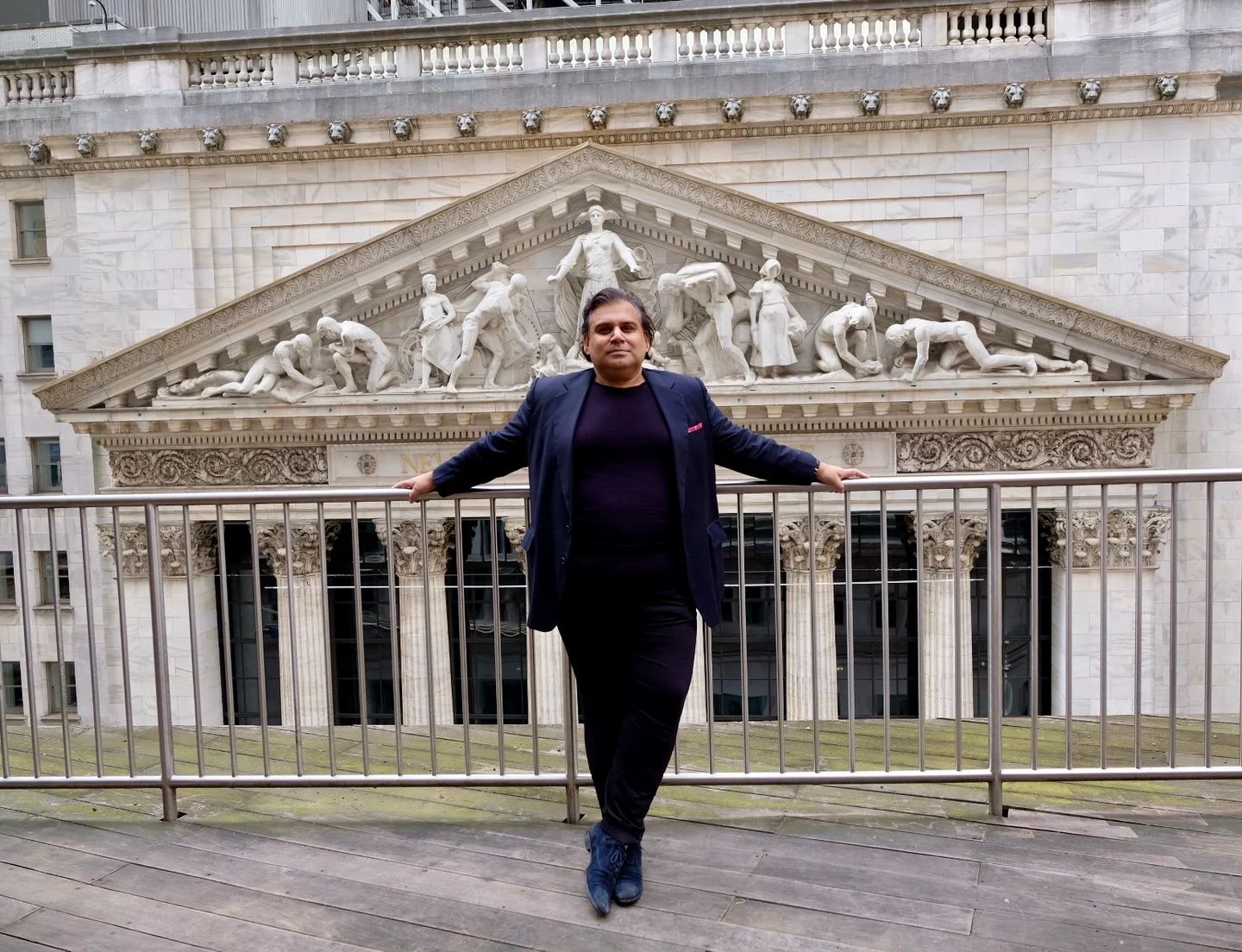 Rishi Bali in front of the New York Stock Exchange.